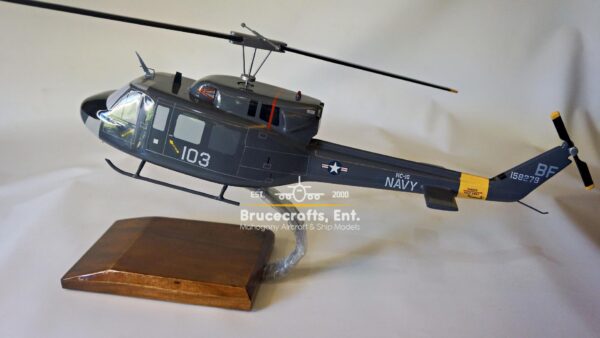 Model of UH-1N Twin Huey US NAVY 103 Aircraft with detailed craftsmanship.